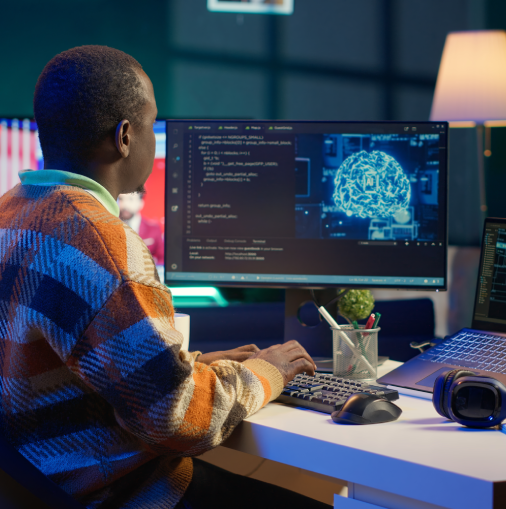 professional-male-developer-manages-neural-network-desk-edited
